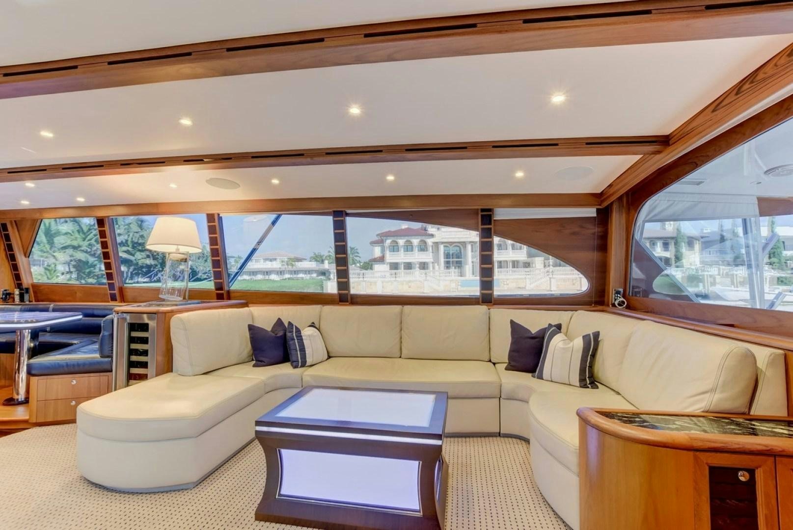 a living room with a large window aboard III AMIGOS Yacht for Sale