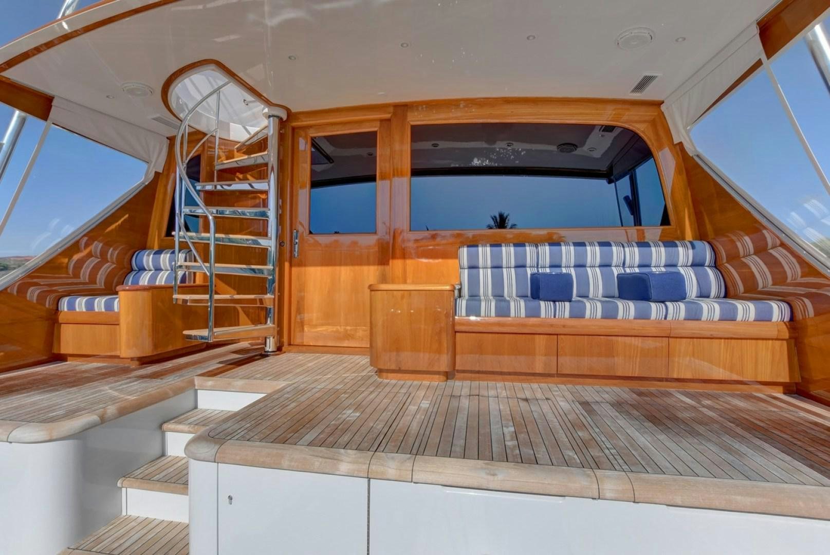 a room with wooden stairs aboard III AMIGOS Yacht for Sale