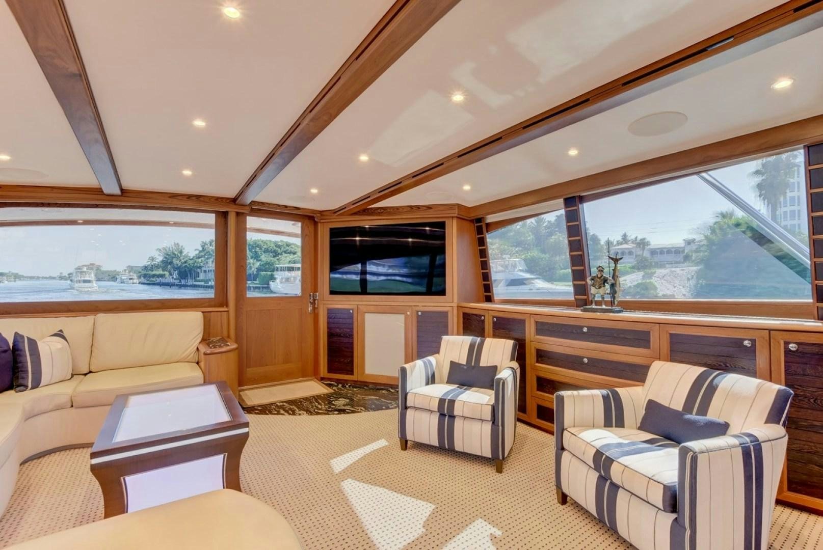 a living room with a large window aboard III AMIGOS Yacht for Sale