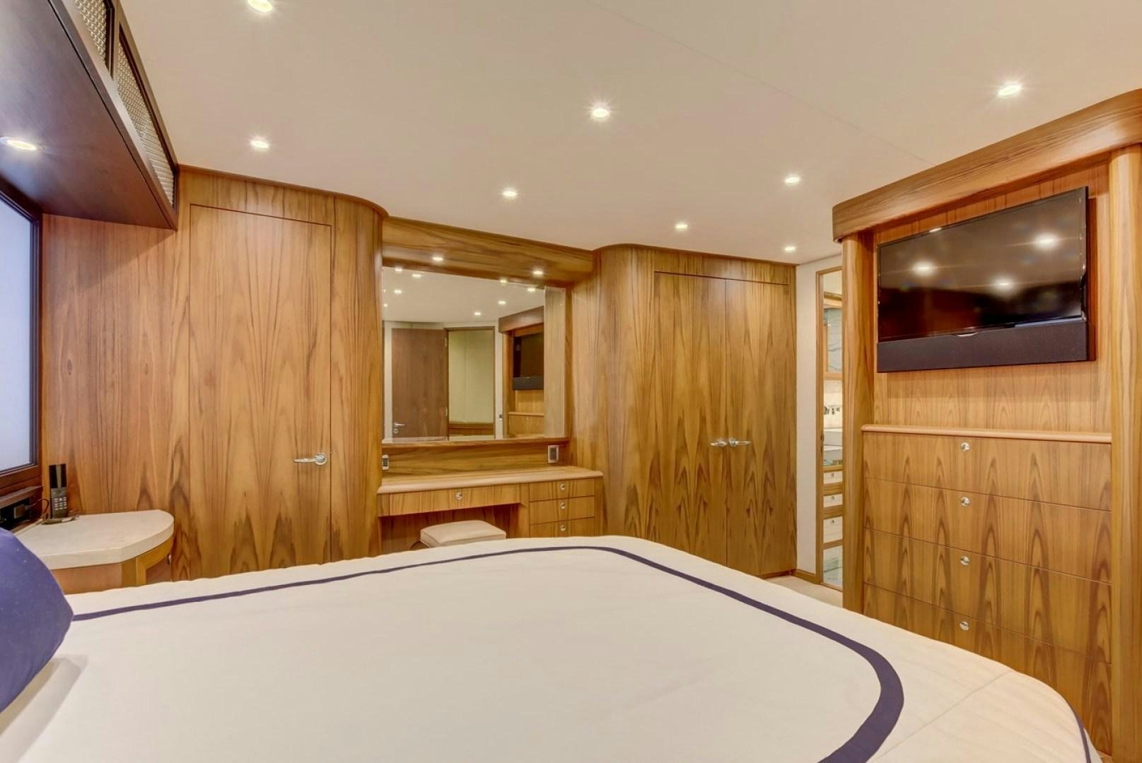 a large bedroom with a large bed aboard III AMIGOS Yacht for Sale