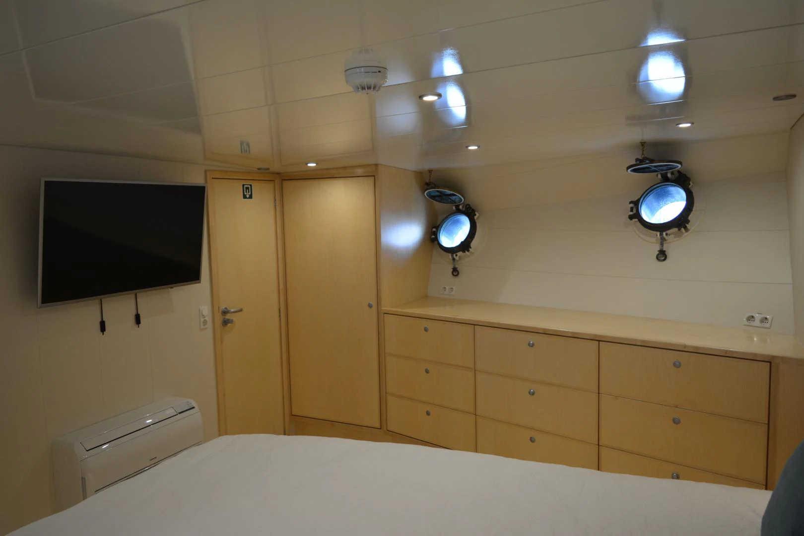 a room with a bed and a television aboard ELENA Yacht for Sale