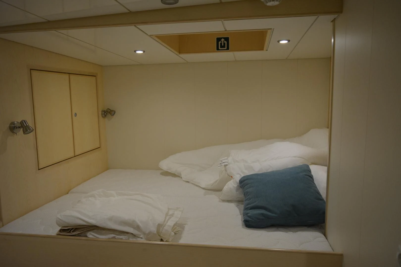 a bed with white sheets aboard ELENA Yacht for Sale