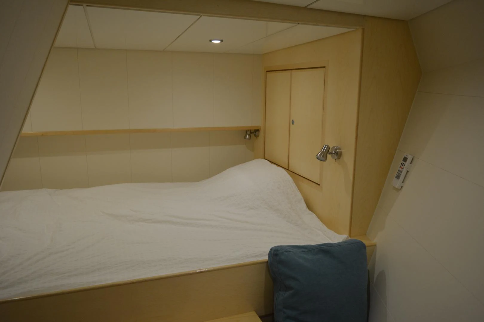 a bed with white sheets aboard ELENA Yacht for Sale