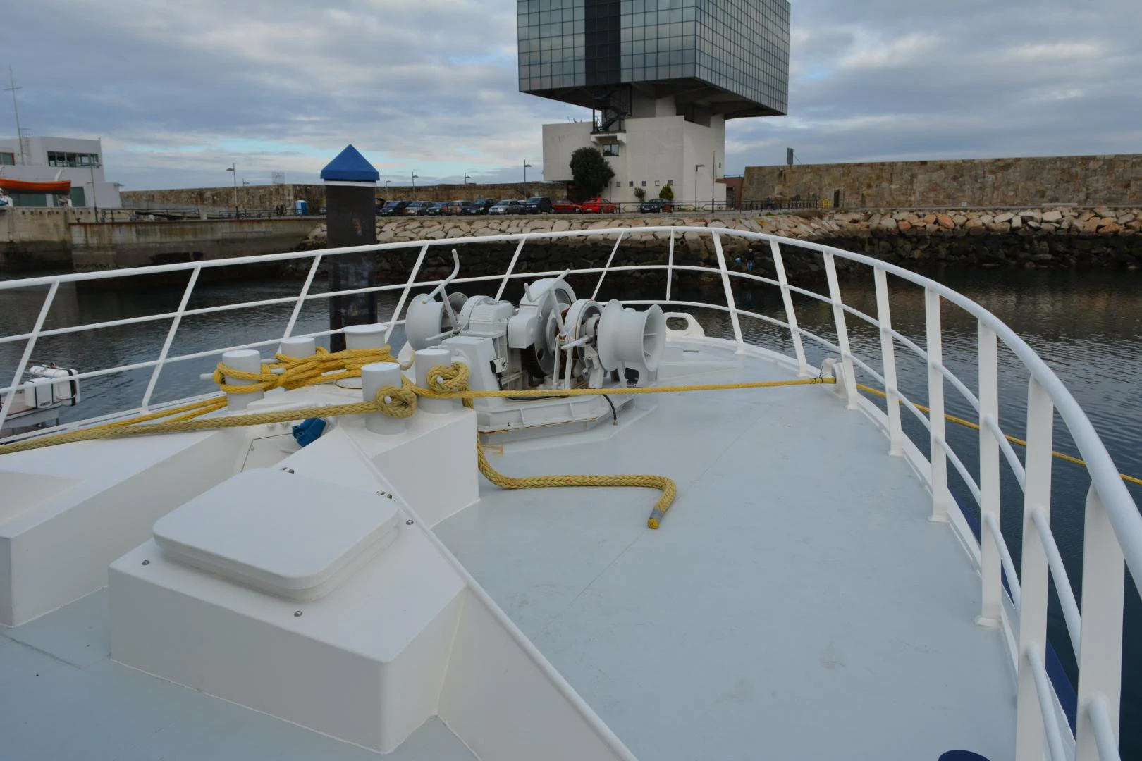 a large white boat with a yellow line on it aboard ELENA Yacht for Sale