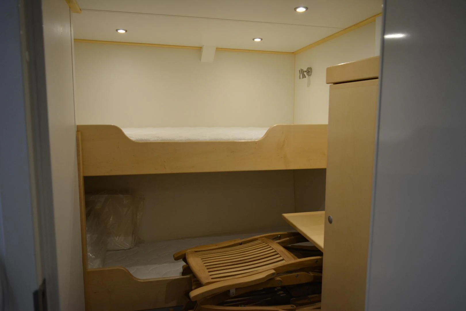 a bed in a room aboard ELENA Yacht for Sale