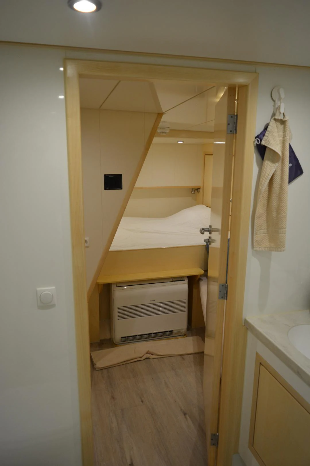 a closet with a bed and a sink aboard ELENA Yacht for Sale