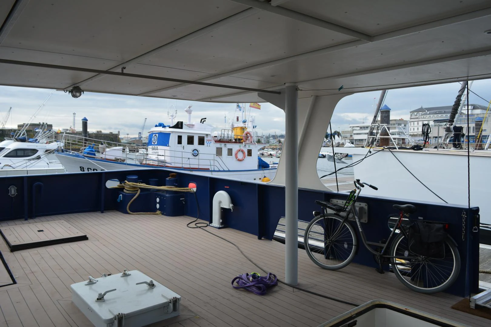 a bicycle parked under a covered area aboard ELENA Yacht for Sale