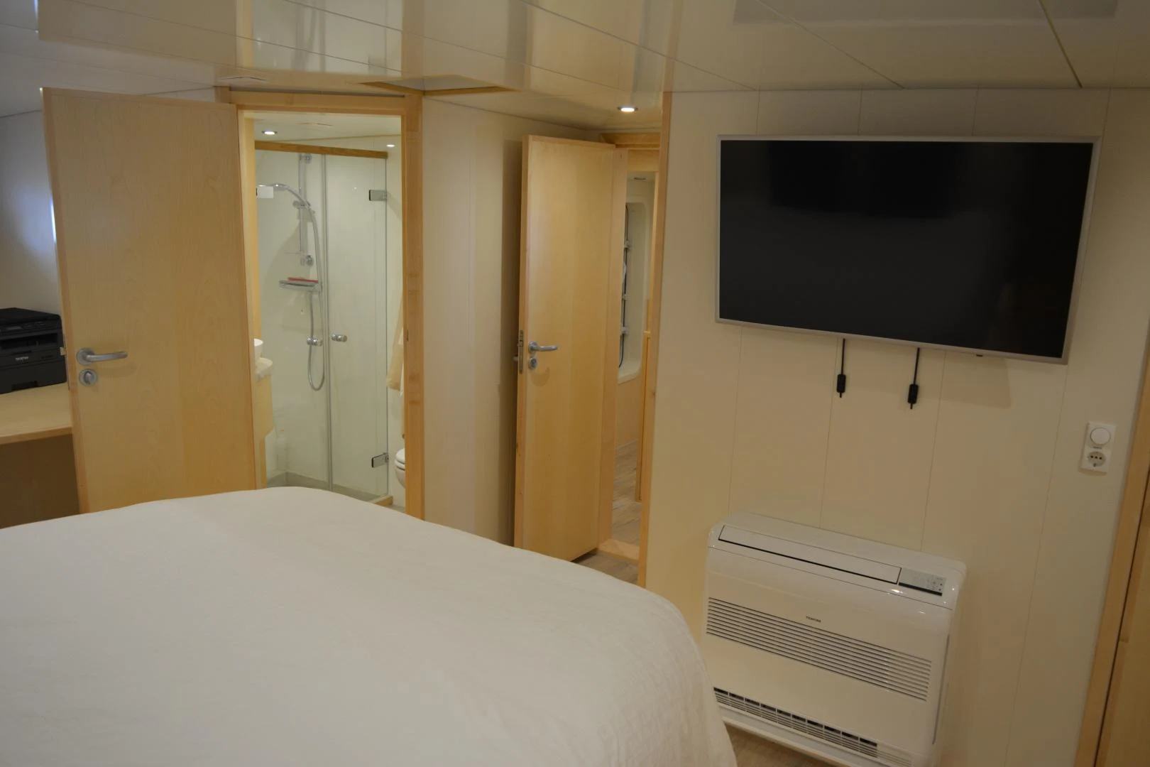 a bed in a room aboard ELENA Yacht for Sale