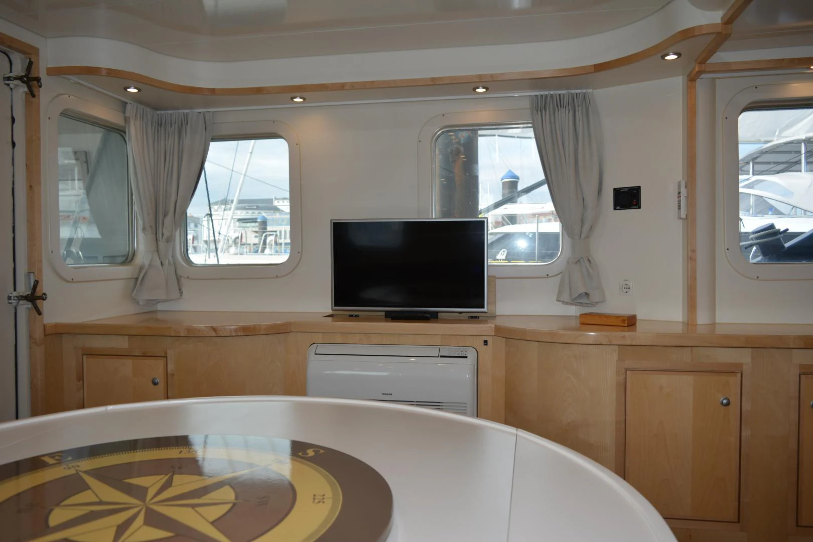 a tv on a cabinet aboard ELENA Yacht for Sale