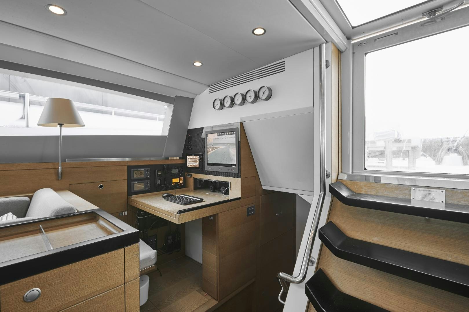 a room with a desk and a bed aboard CAPRICHO II Yacht for Sale