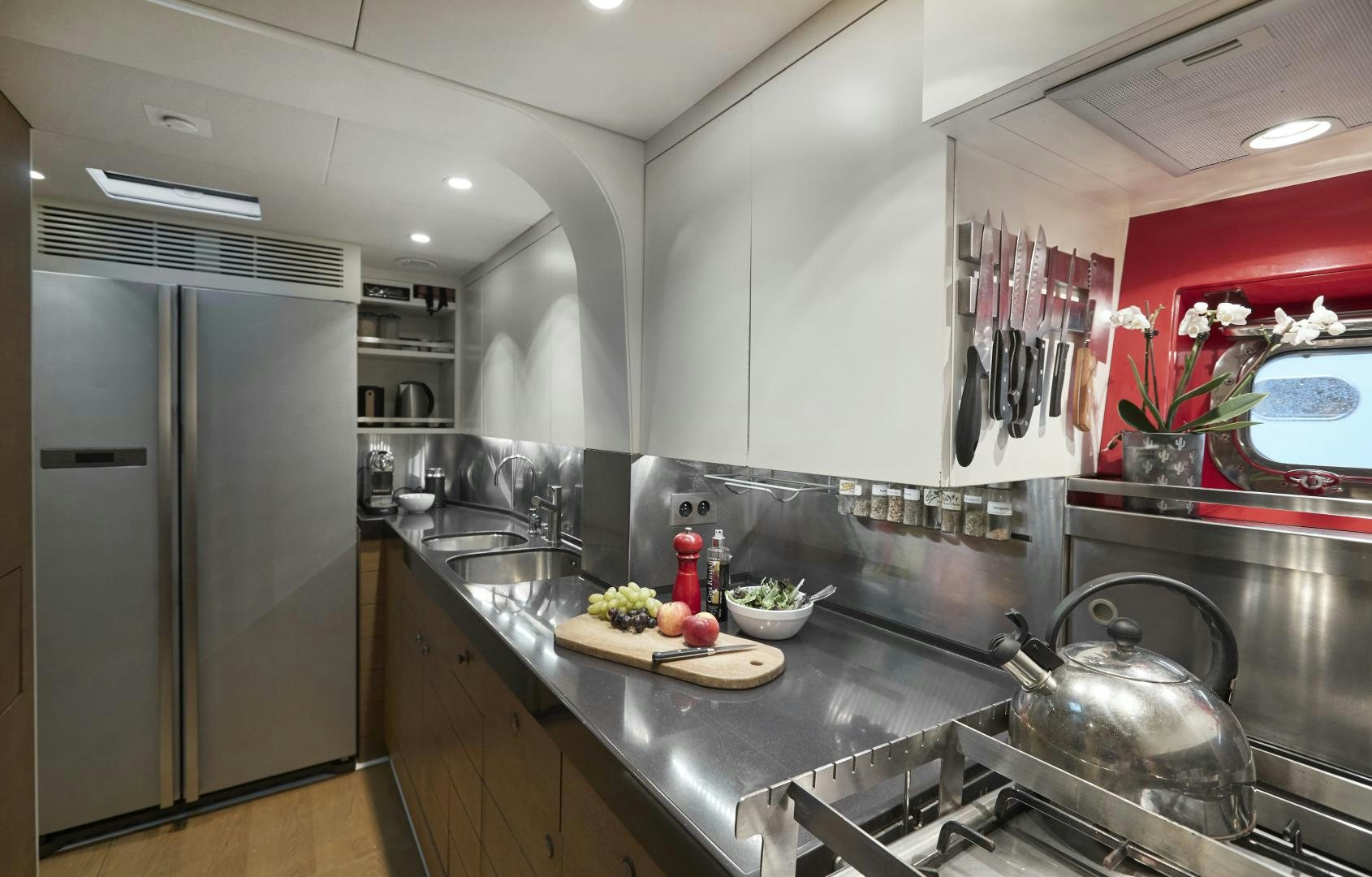 a kitchen with stainless steel appliances aboard CAPRICHO II Yacht for Sale