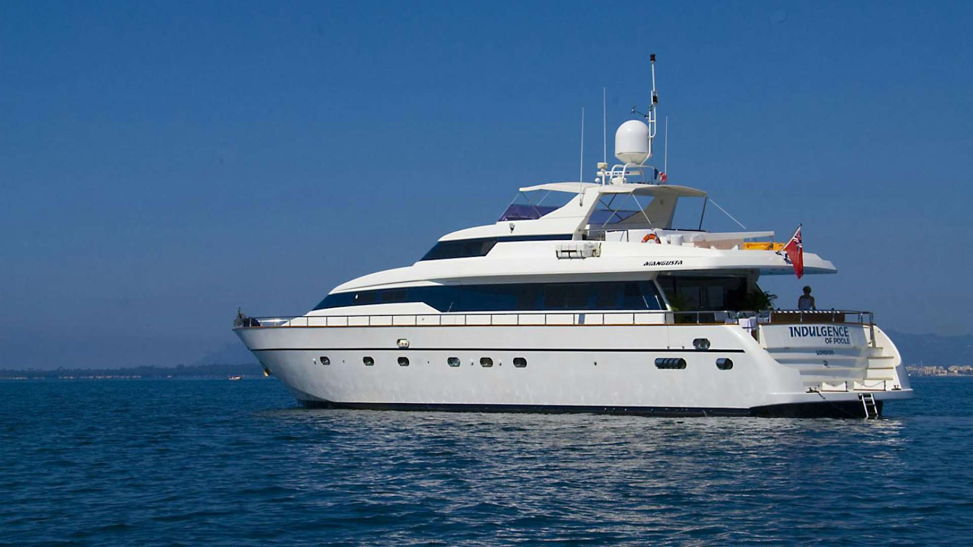 a white boat in the water aboard INDULGENCE OF POOLE Yacht for Sale