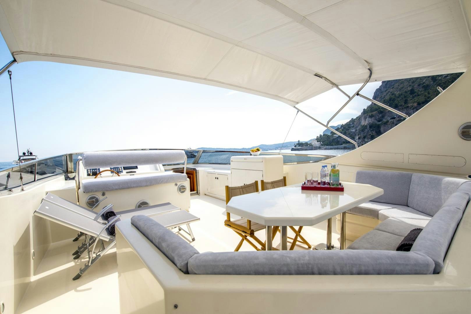 a room with a bed and a table aboard ACE1 Yacht for Sale