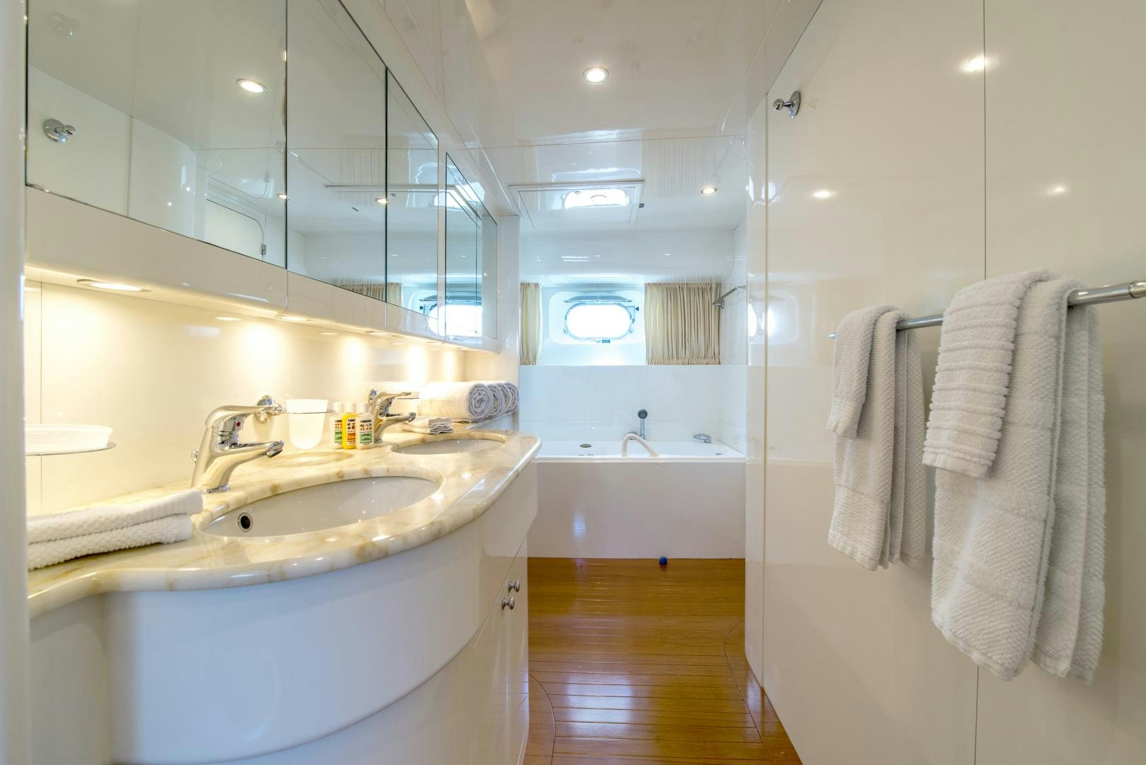 a bathroom with a sink and a bathtub aboard ACE1 Yacht for Sale