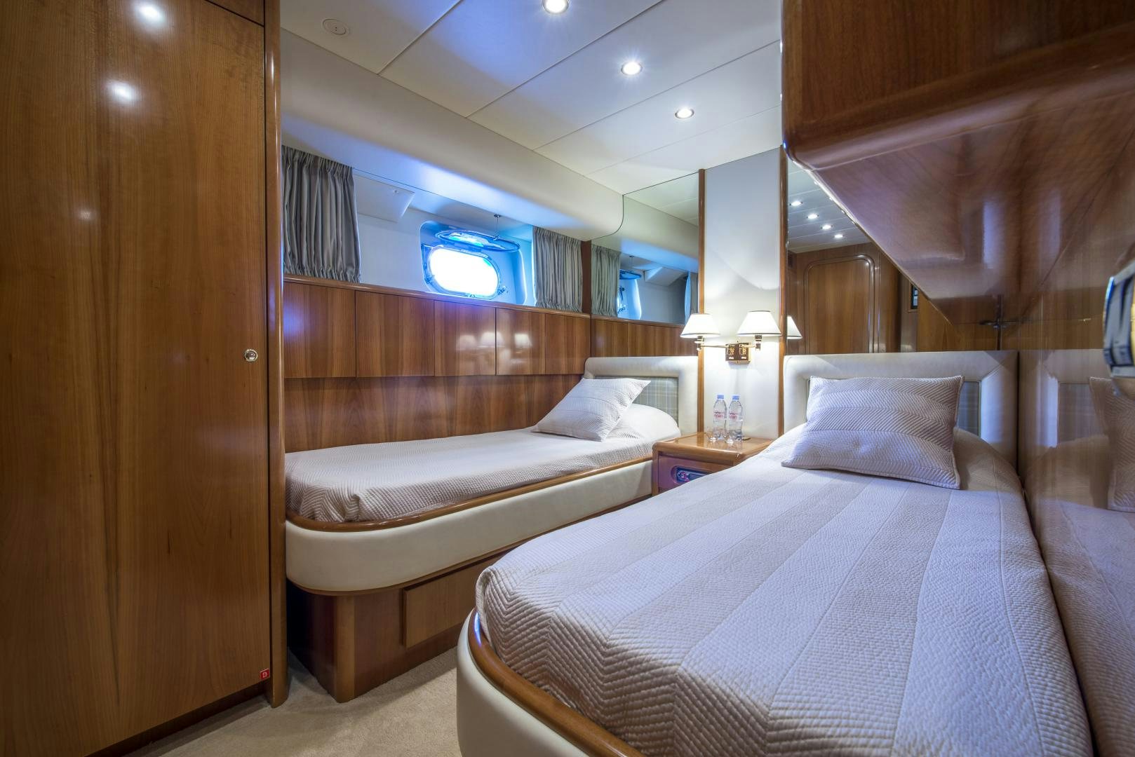 a room with two beds aboard ACE1 Yacht for Sale