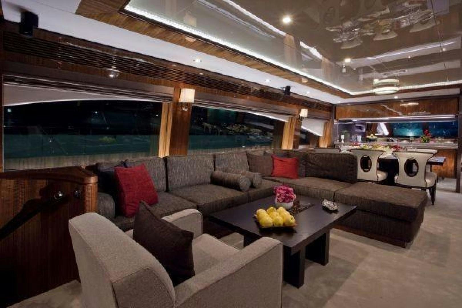 a living room with a couch and a table aboard LUCKY DOG Yacht for Sale