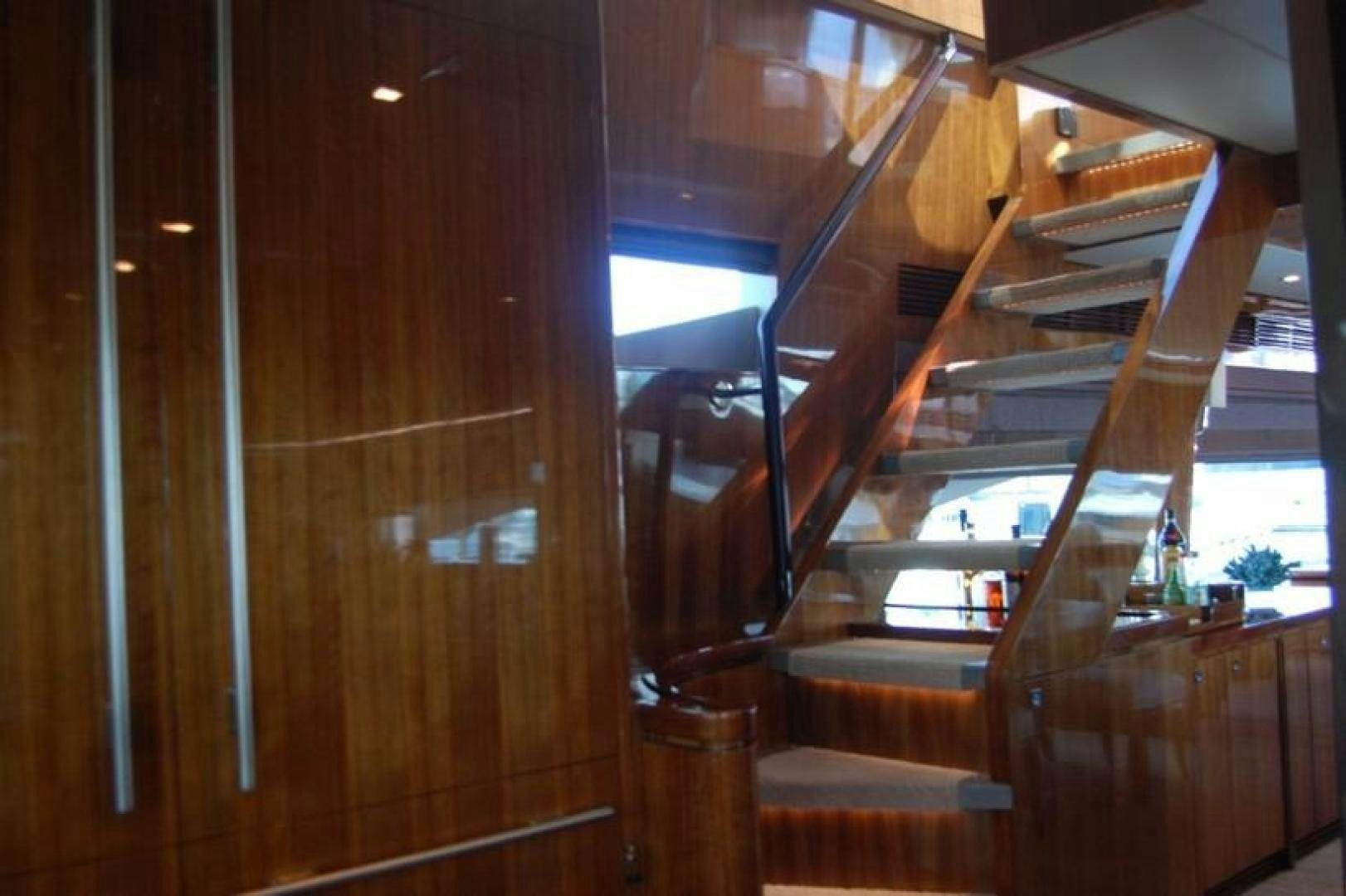 a wooden staircase with wood walls aboard LUCKY DOG Yacht for Sale