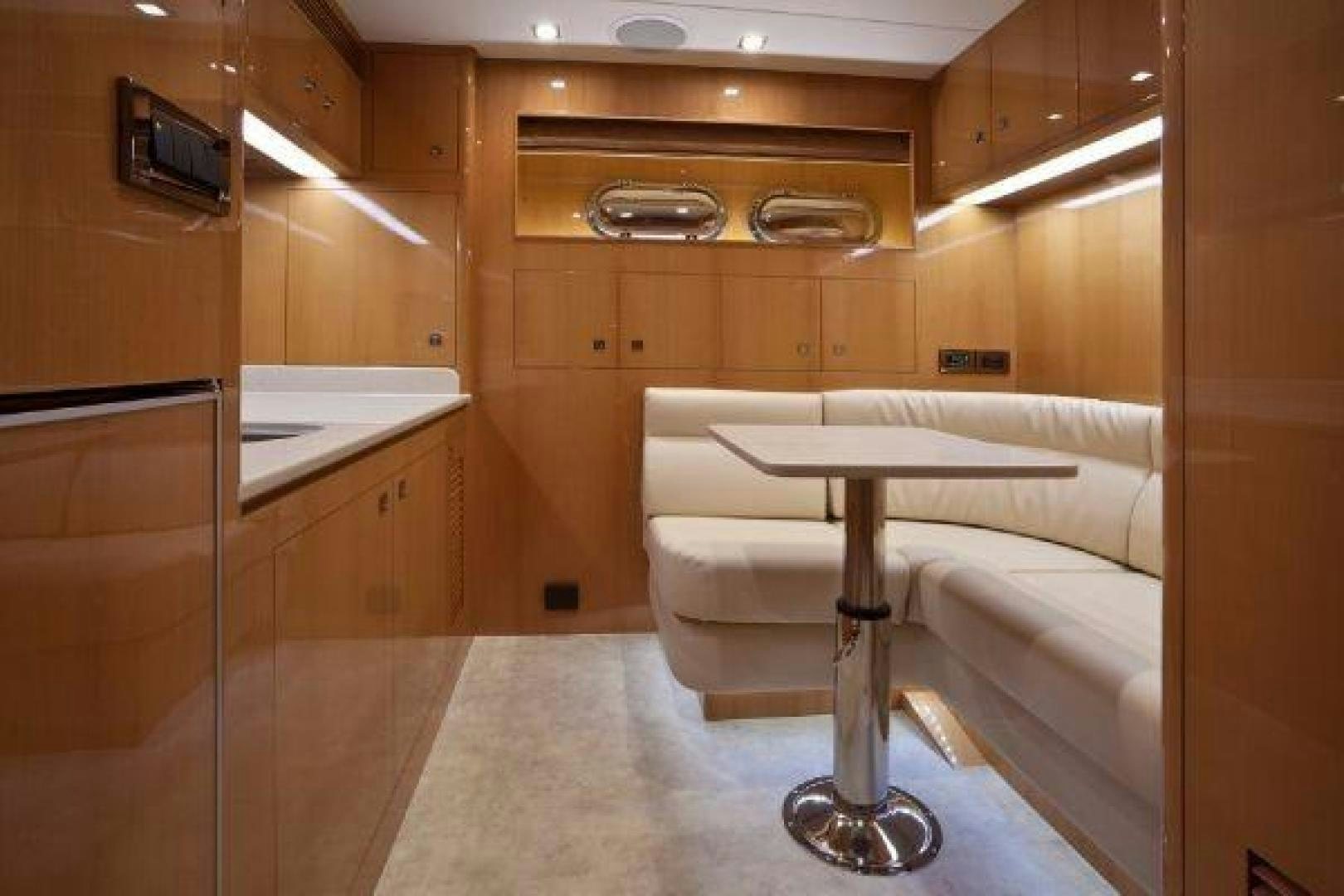 a room with a table and a couch aboard LUCKY DOG Yacht for Sale