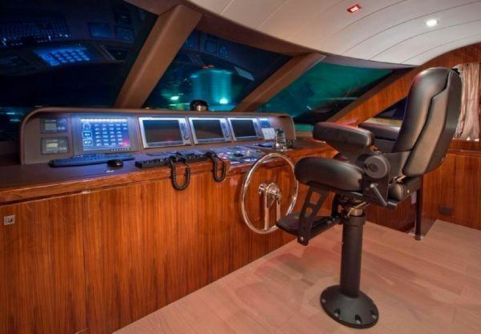 a chair and a desk in a room aboard LUCKY DOG Yacht for Sale