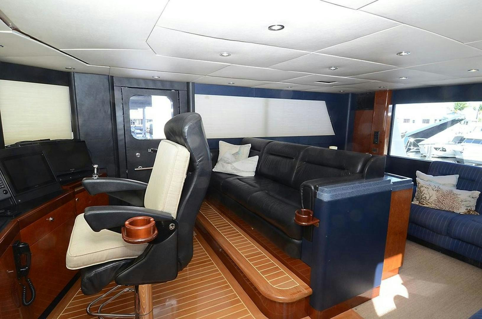 a room with a couch and a table and a television aboard ARTHUR'S WAY Yacht for Sale