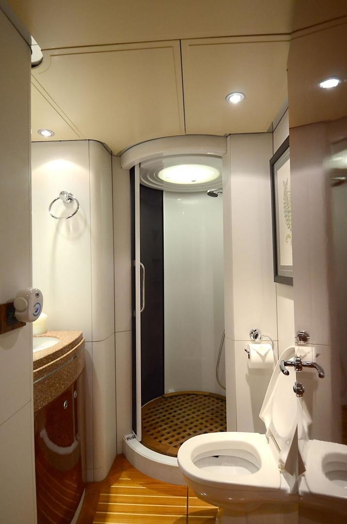 a bathroom with a toilet and a sink aboard ARTHUR'S WAY Yacht for Sale