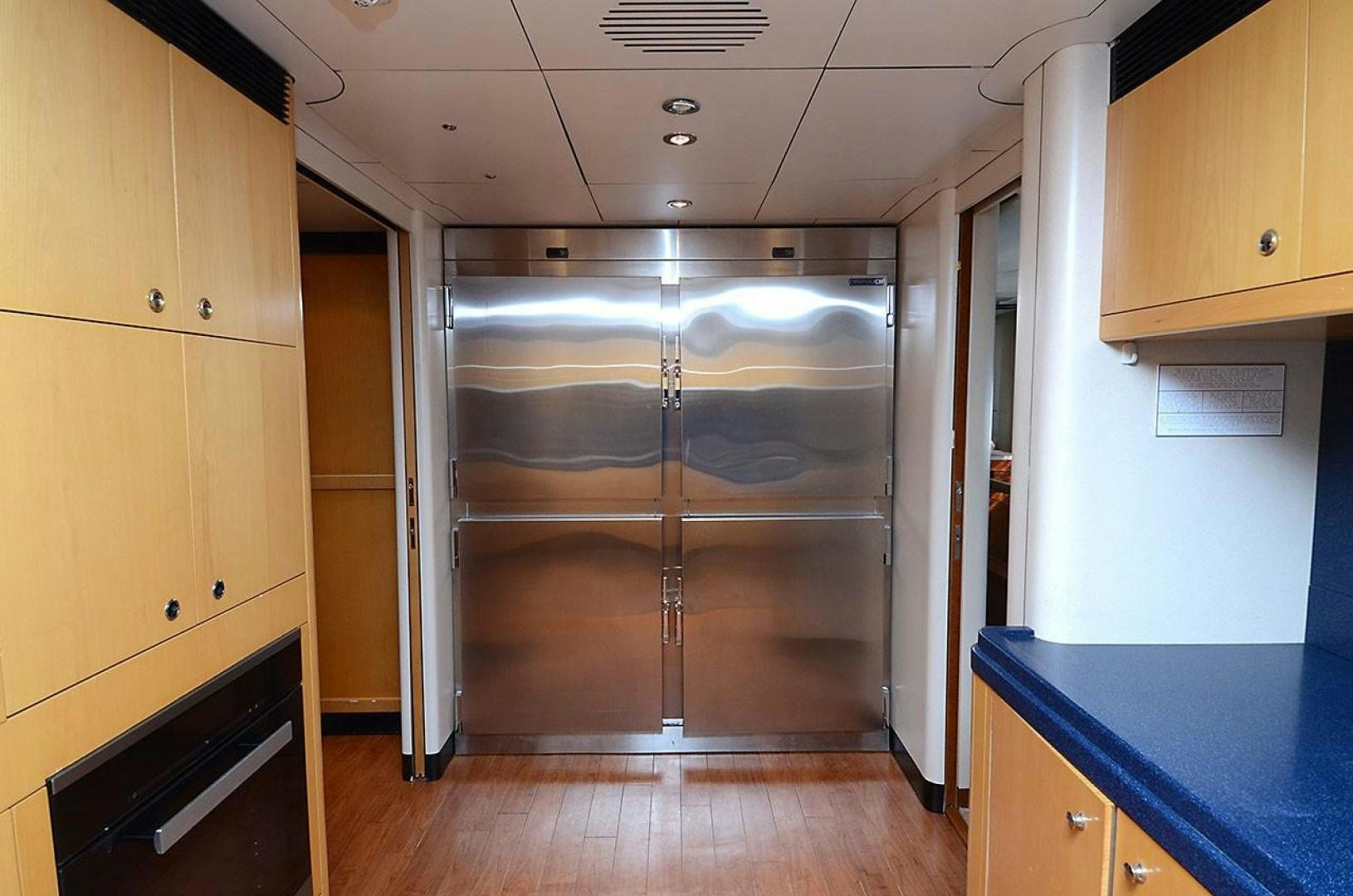 a room with a wood door and a glass wall aboard ARTHUR'S WAY Yacht for Sale
