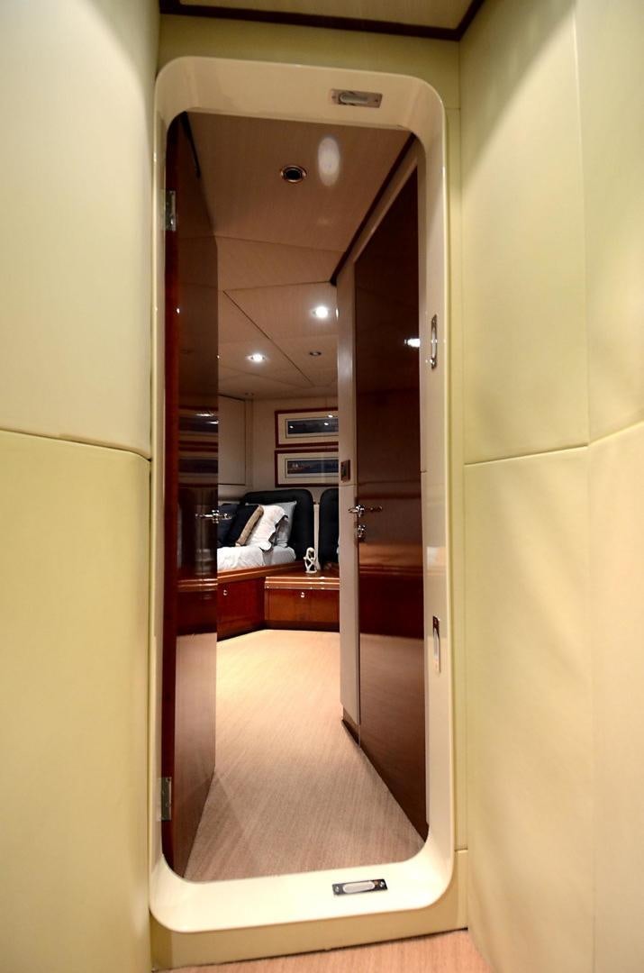 a mirror showing a sink and a door aboard ARTHUR'S WAY Yacht for Sale