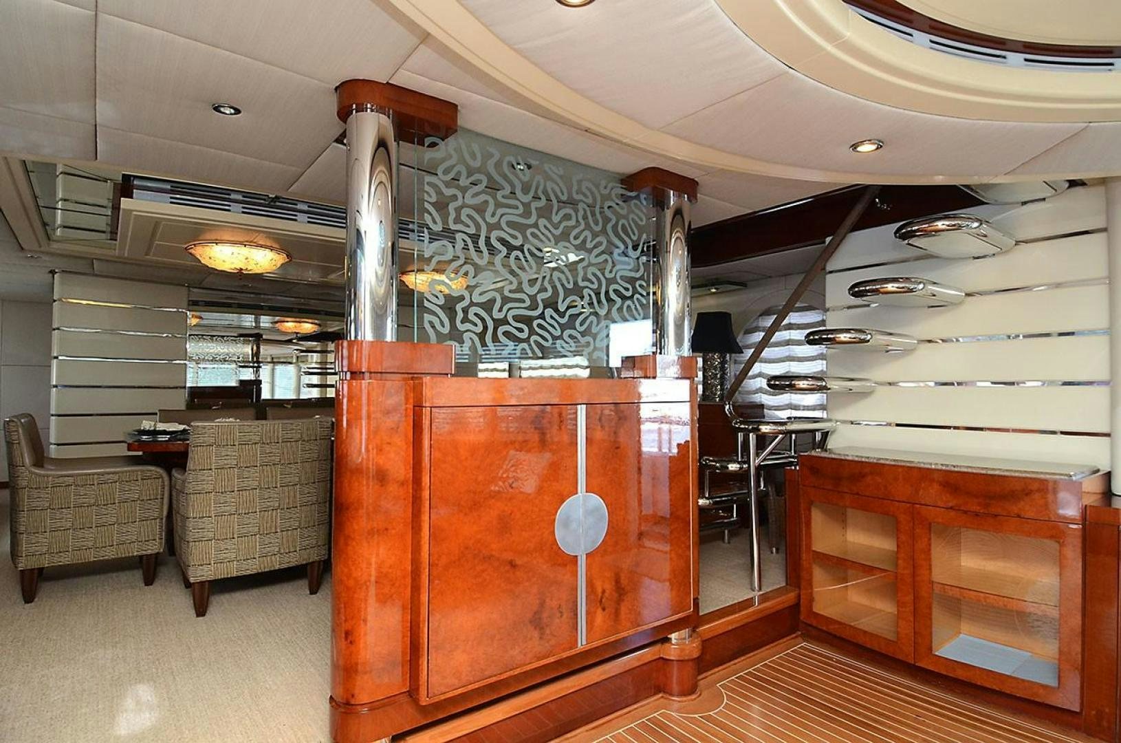 a room with a couch and a wood cabinet aboard ARTHUR'S WAY Yacht for Sale