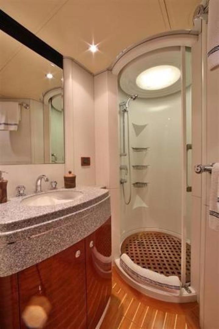 a bathroom with a shower sink and a mirror aboard ARTHUR'S WAY Yacht for Sale