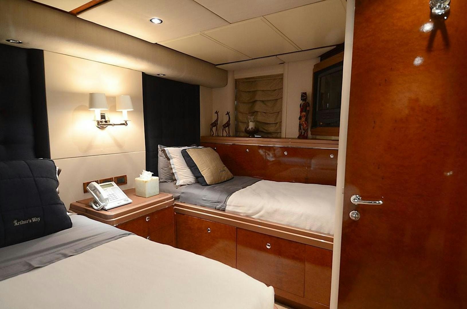 a room with a bed and a desk aboard ARTHUR'S WAY Yacht for Sale