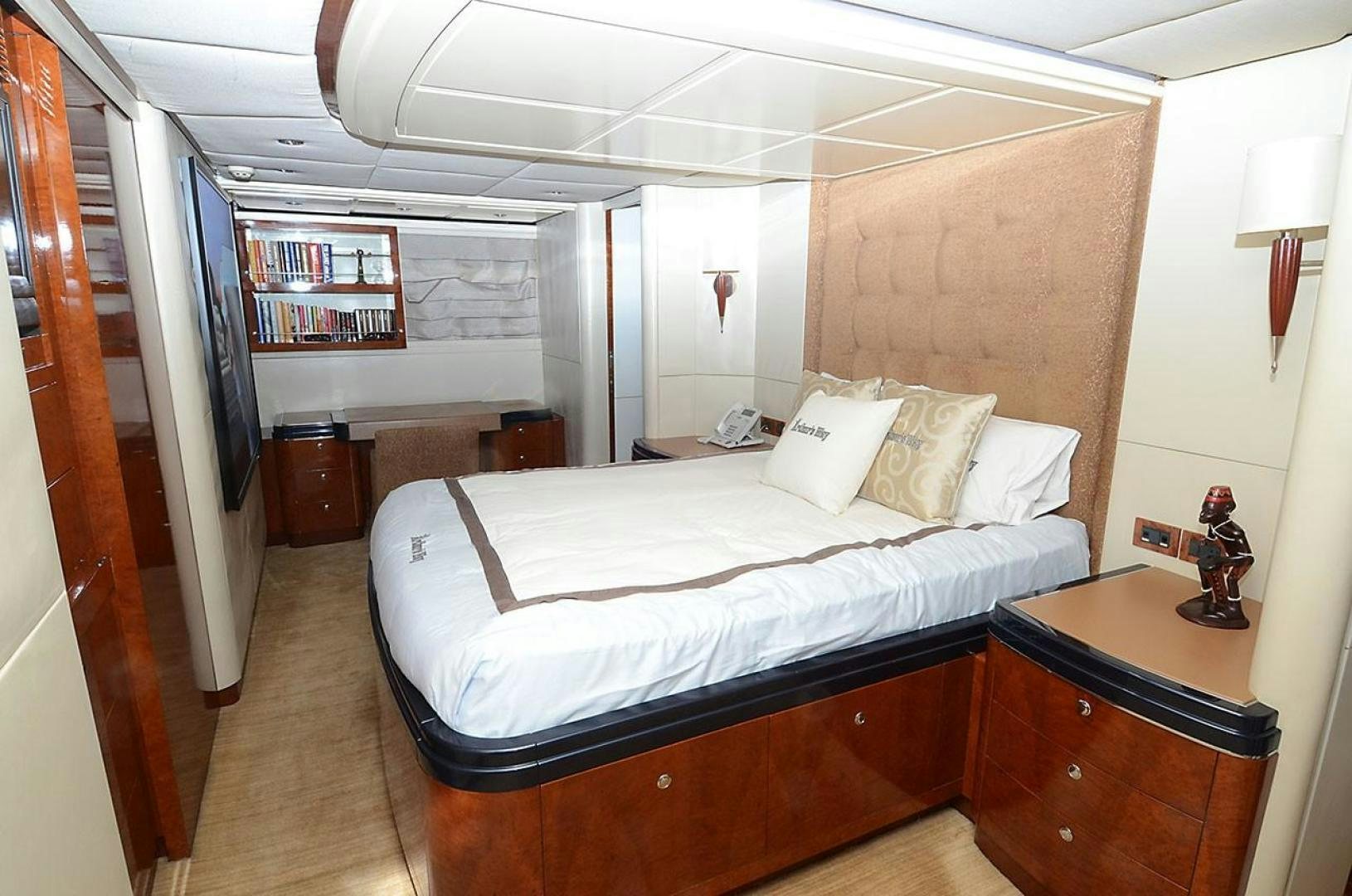 a bedroom with a bed and a desk aboard ARTHUR'S WAY Yacht for Sale