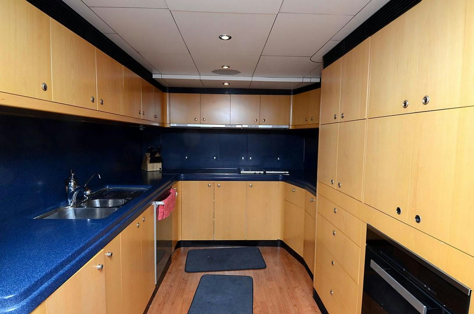 a kitchen with a sink and cabinets aboard ARTHUR'S WAY Yacht for Sale