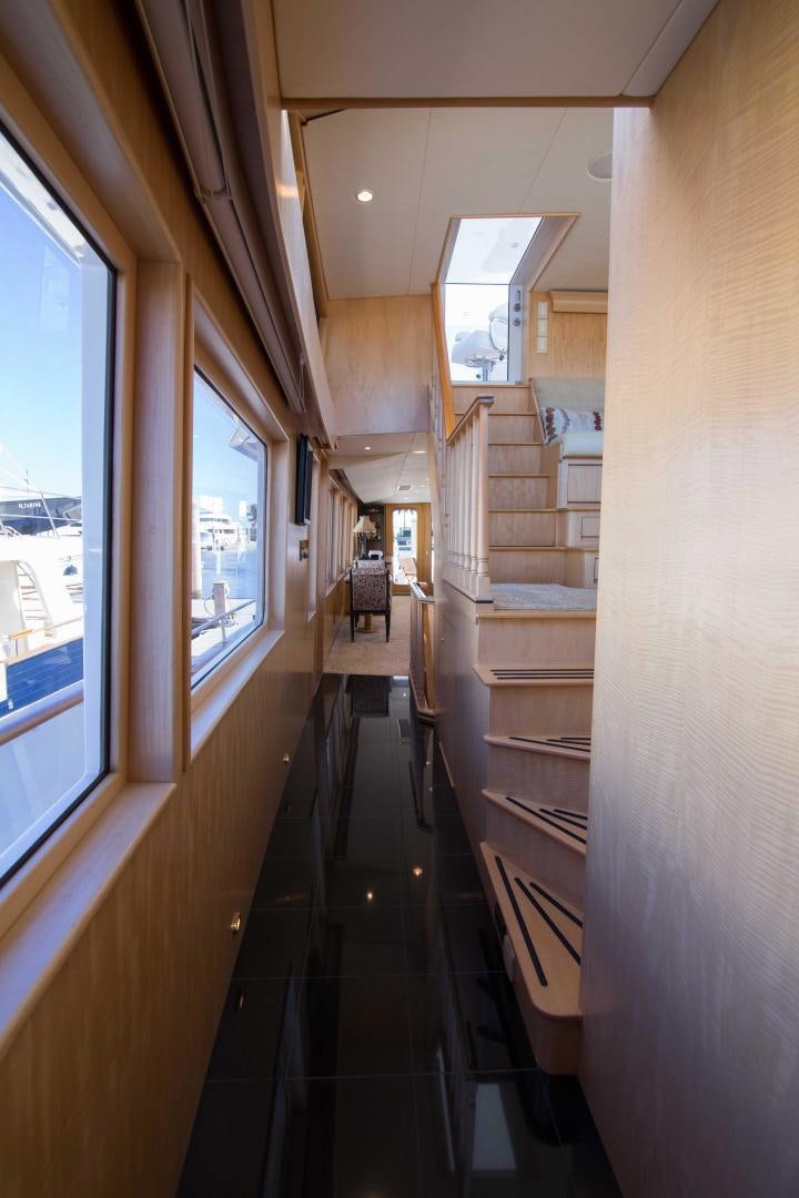 a hallway with wooden stairs aboard ROAMIN' HOLIDAY Yacht for Sale