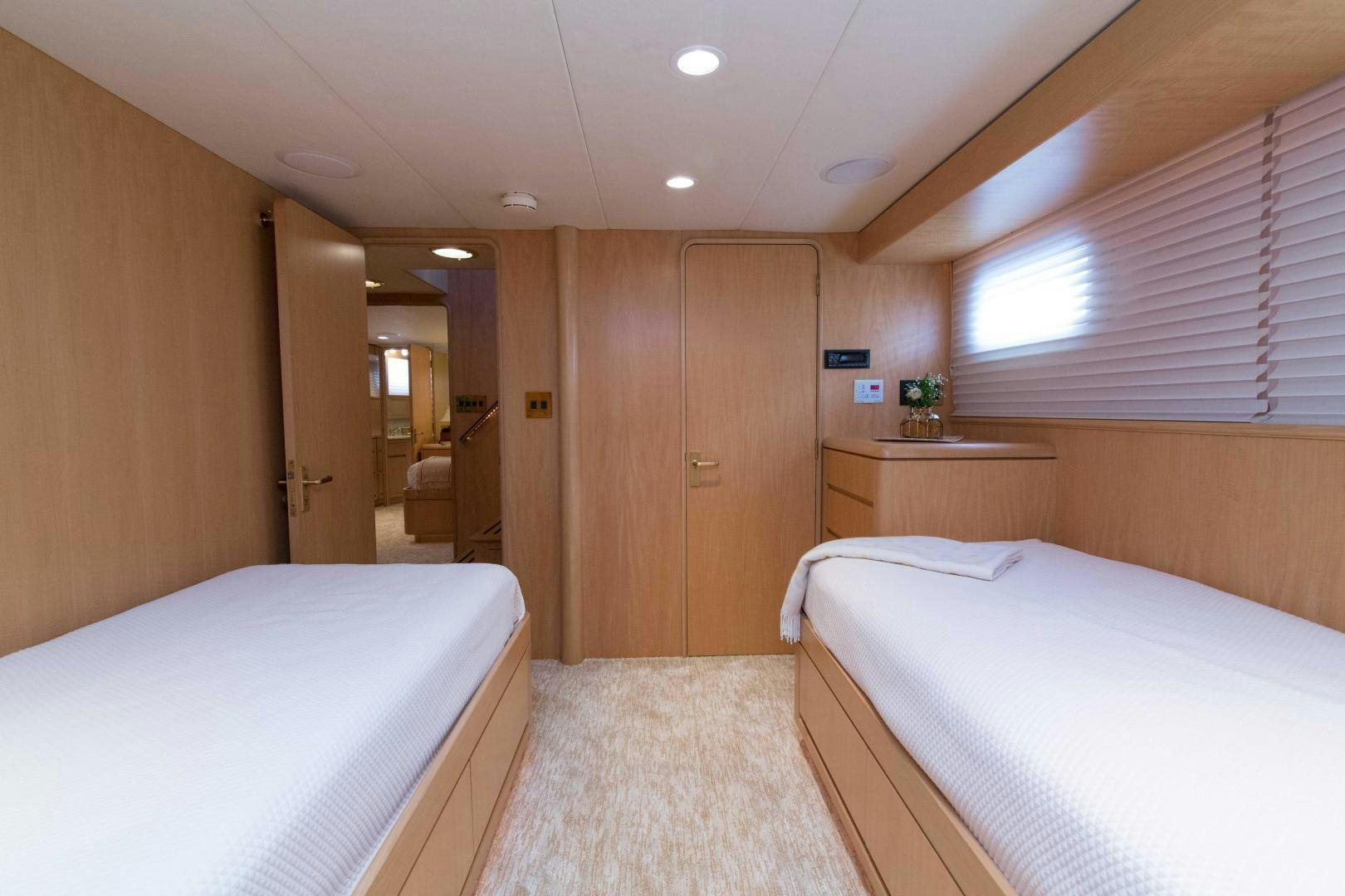 a room with a bed and a closet aboard ROAMIN' HOLIDAY Yacht for Sale