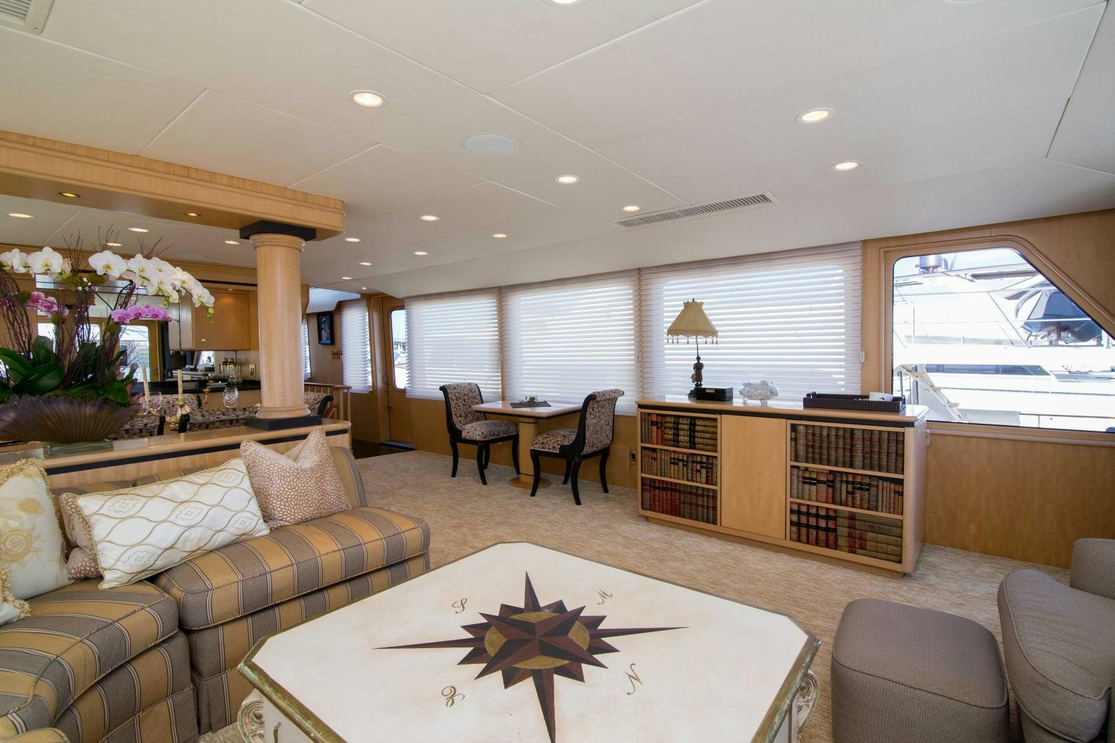 a living room with a couch and a coffee table aboard ROAMIN' HOLIDAY Yacht for Sale
