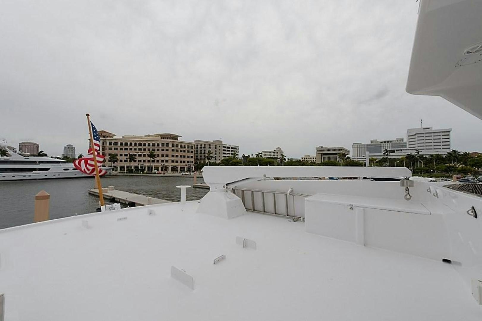 a large snowy area with buildings and flags in the background aboard ROAMIN' HOLIDAY Yacht for Sale
