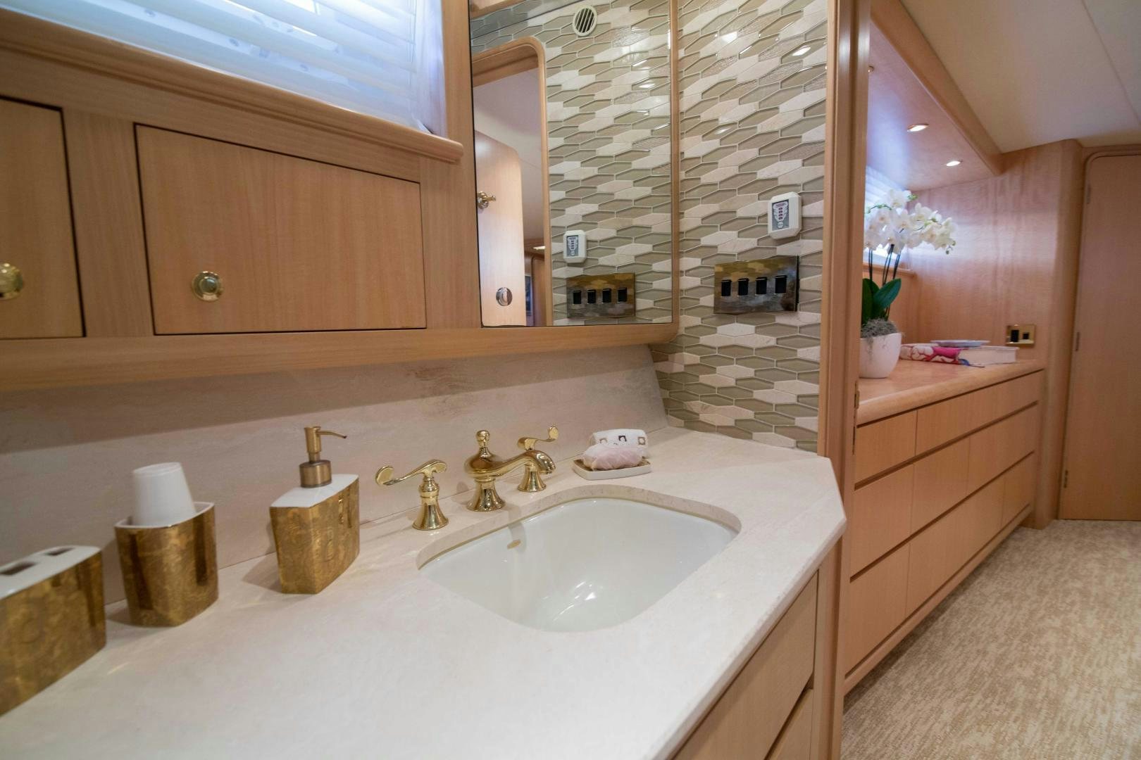 a bathroom with a sink and cabinets aboard ROAMIN' HOLIDAY Yacht for Sale
