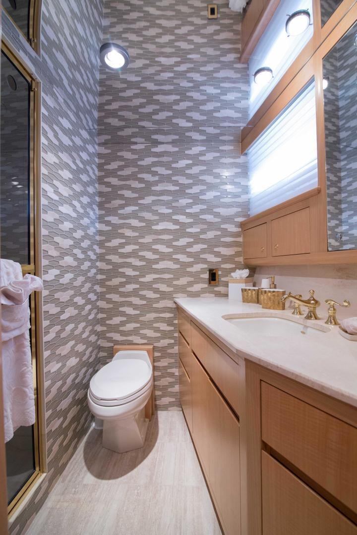 a bathroom with a toilet and sink aboard ROAMIN' HOLIDAY Yacht for Sale