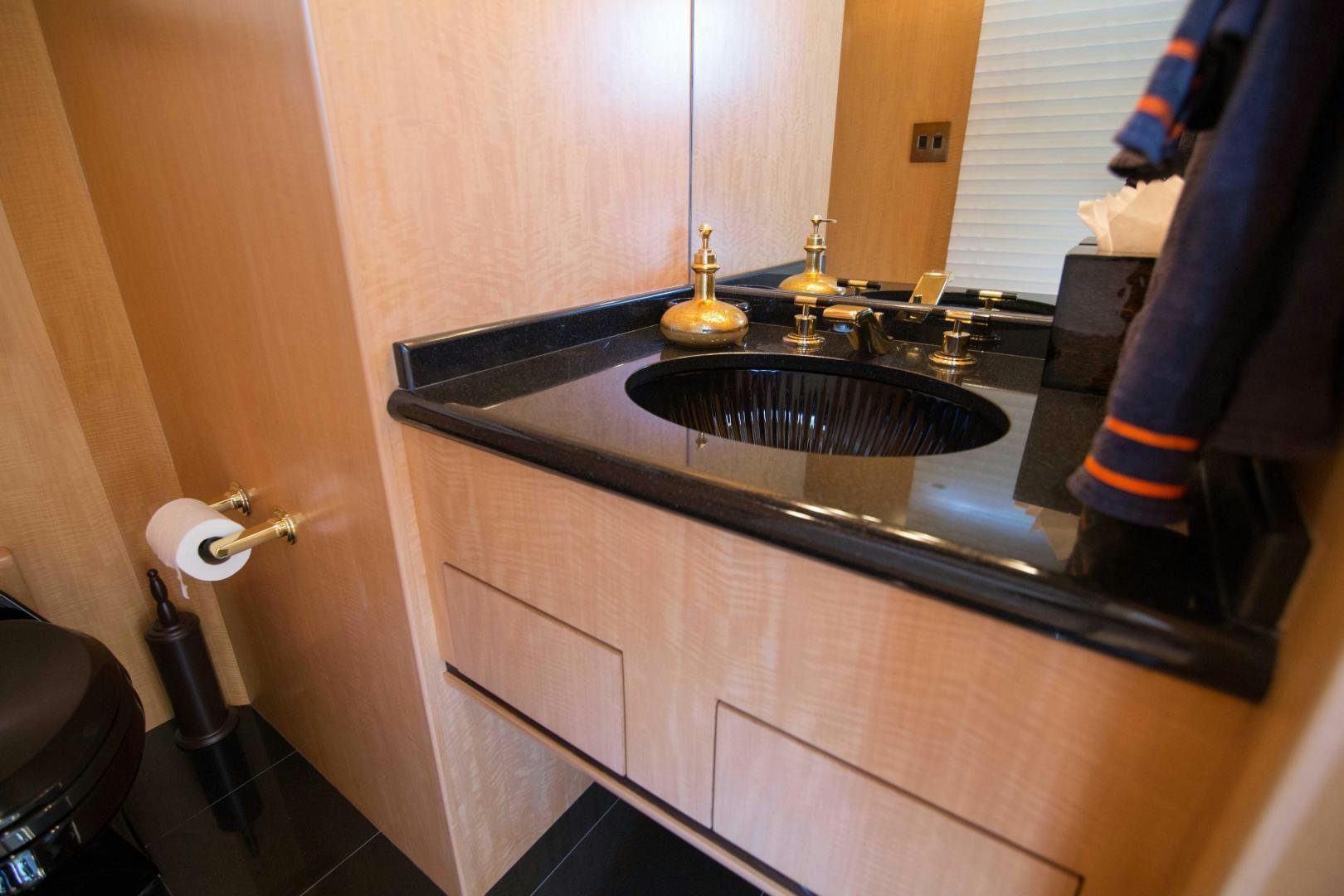 a bathroom sink with a mirror aboard ROAMIN' HOLIDAY Yacht for Sale