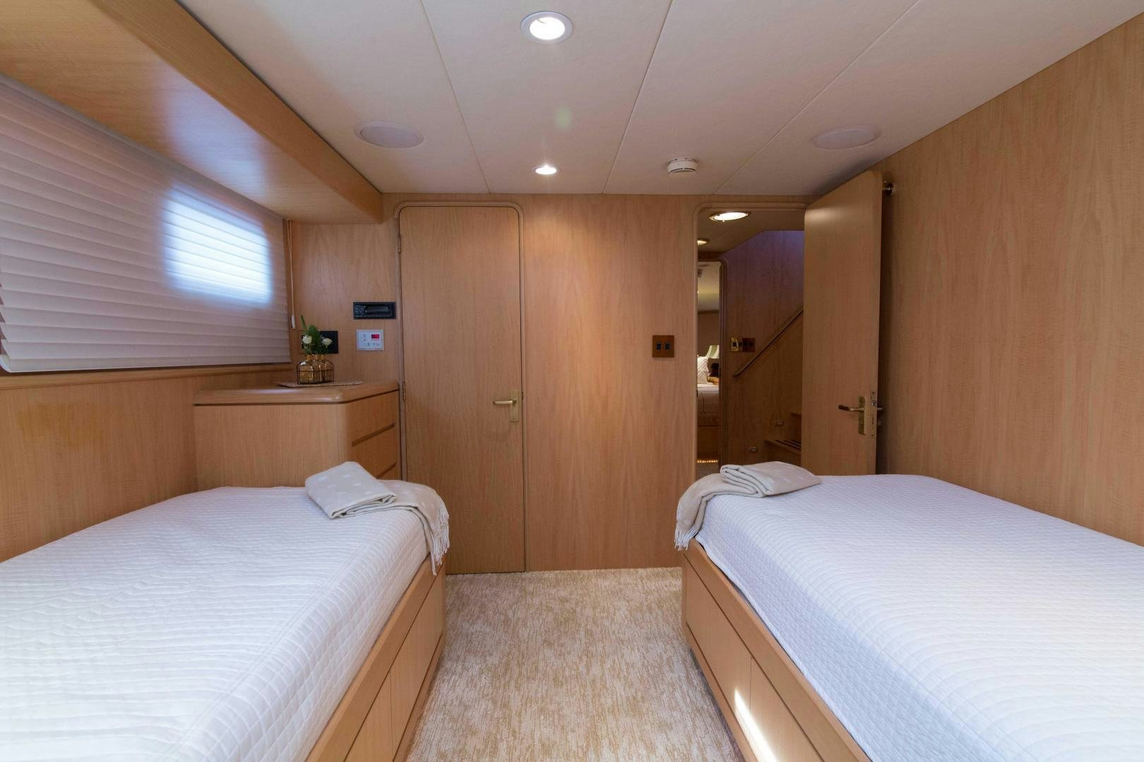 a room with a couple of beds aboard ROAMIN' HOLIDAY Yacht for Sale