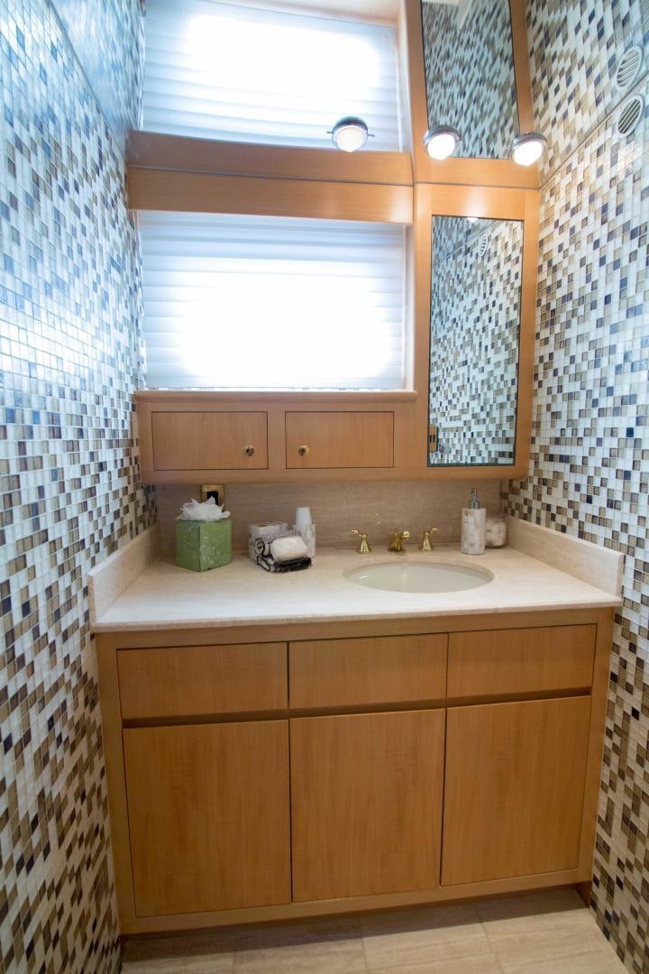 a bathroom with a sink and a window aboard ROAMIN' HOLIDAY Yacht for Sale