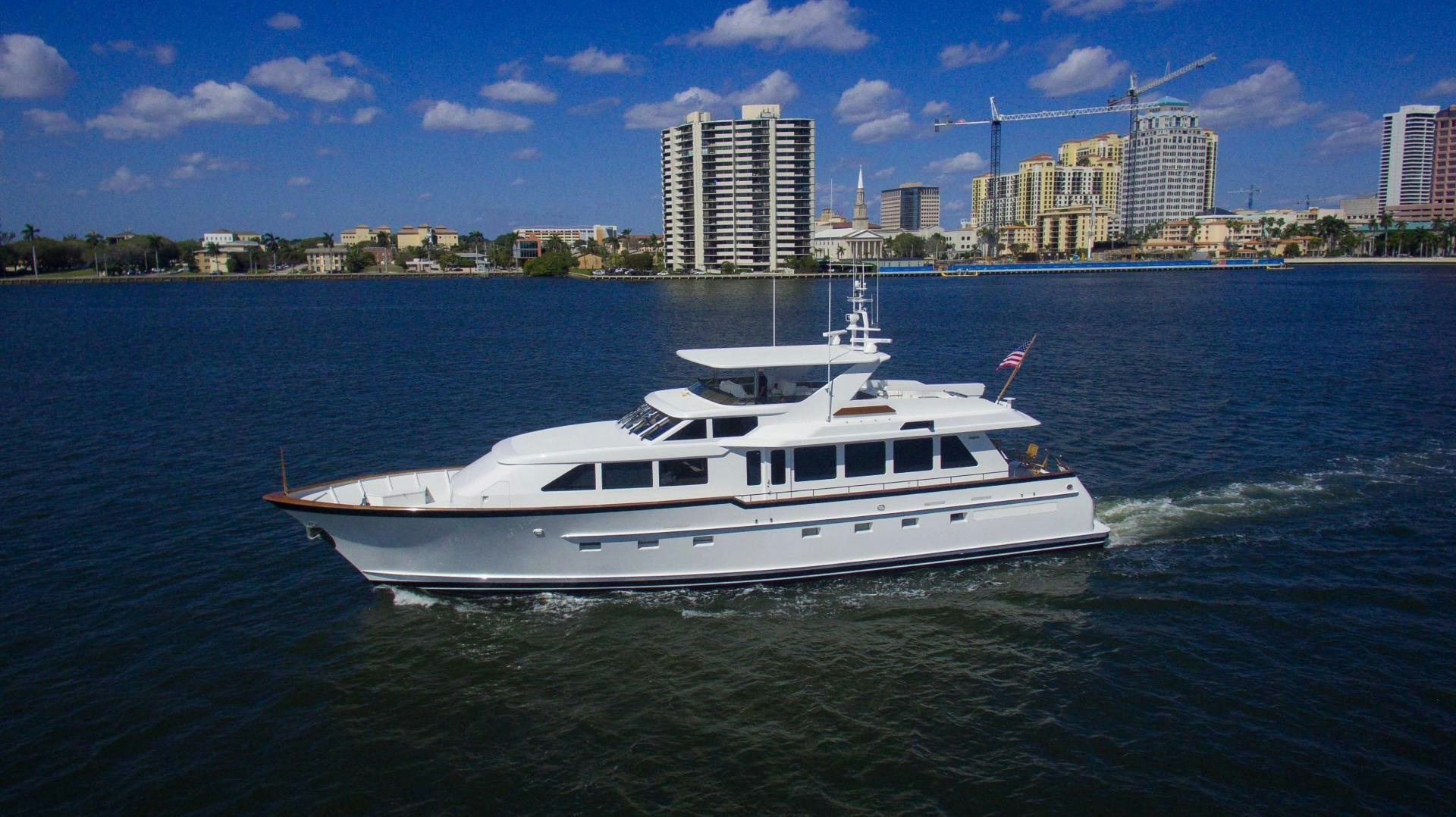 a white boat on the water aboard ROAMIN' HOLIDAY Yacht for Sale