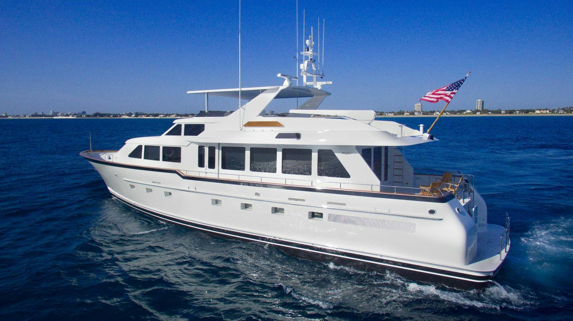 a white yacht on the water aboard ROAMIN' HOLIDAY Yacht for Sale