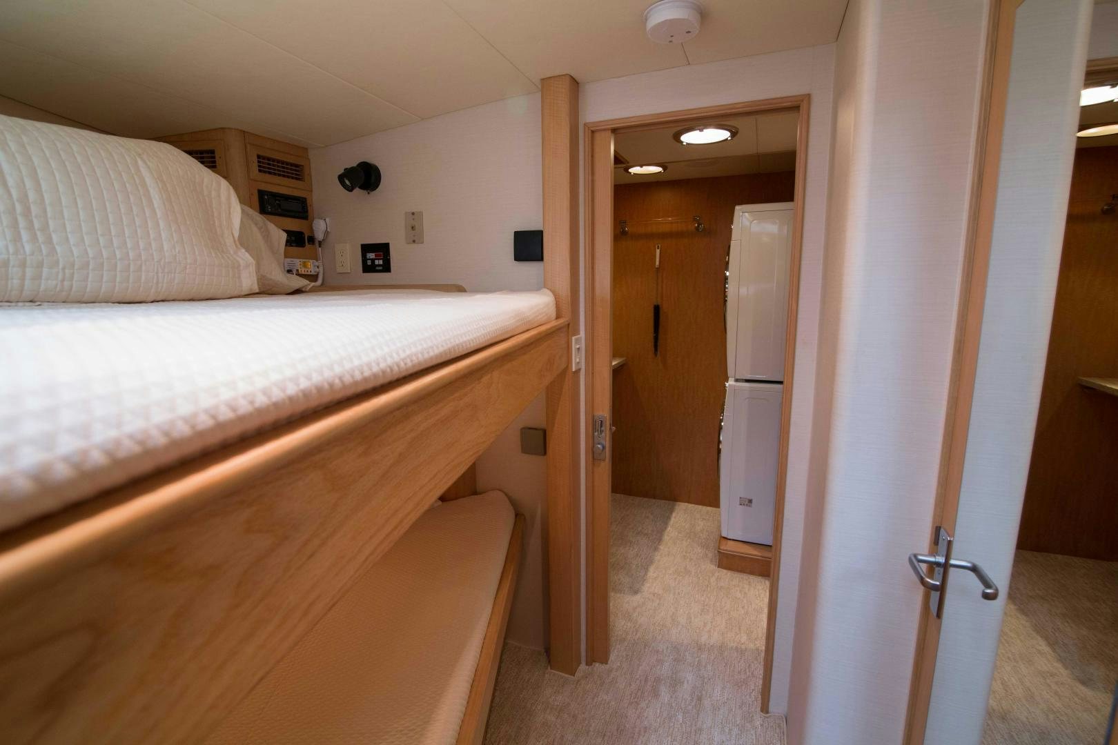 a room with a bed and a door aboard ROAMIN' HOLIDAY Yacht for Sale