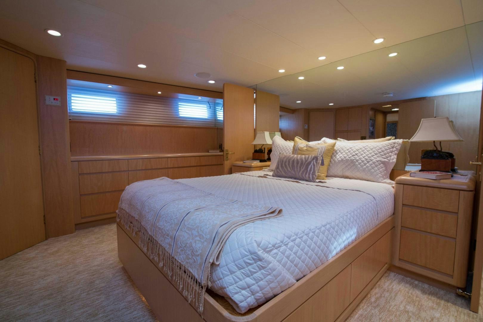 a bedroom with a bed and a desk aboard ROAMIN' HOLIDAY Yacht for Sale