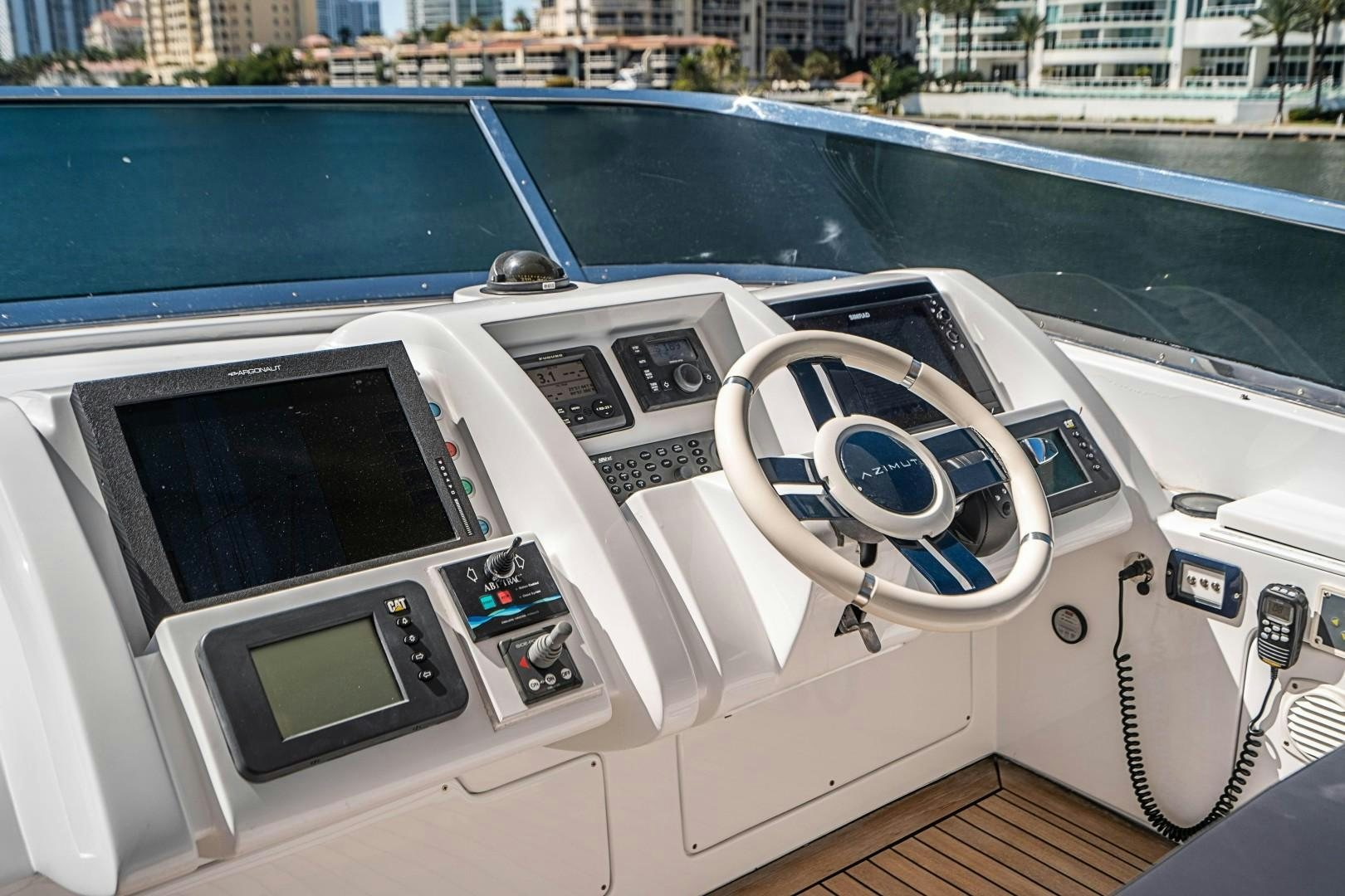 the inside of a car aboard Blue Yacht for Sale