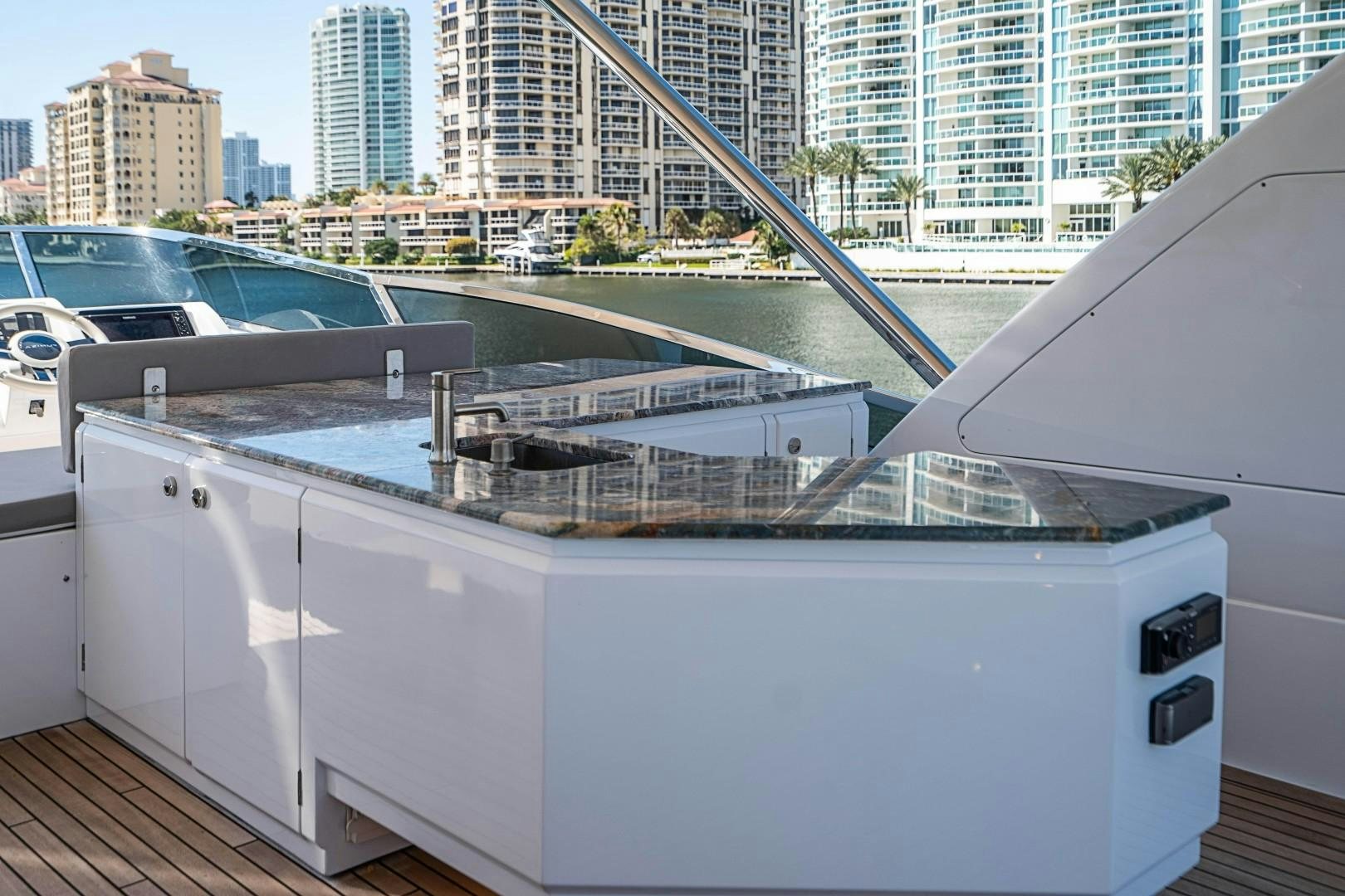 a white car with a large windshield aboard Blue Yacht for Sale