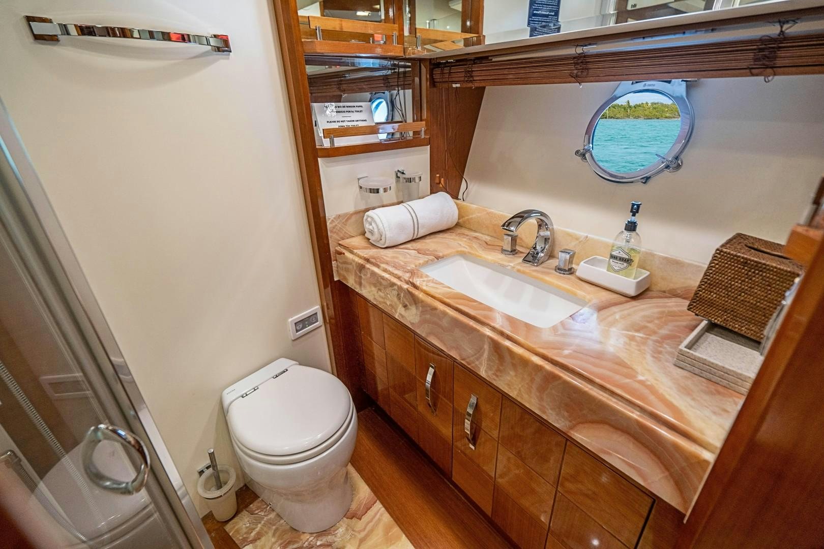 a bathroom with a sink and a toilet aboard Blue Yacht for Sale