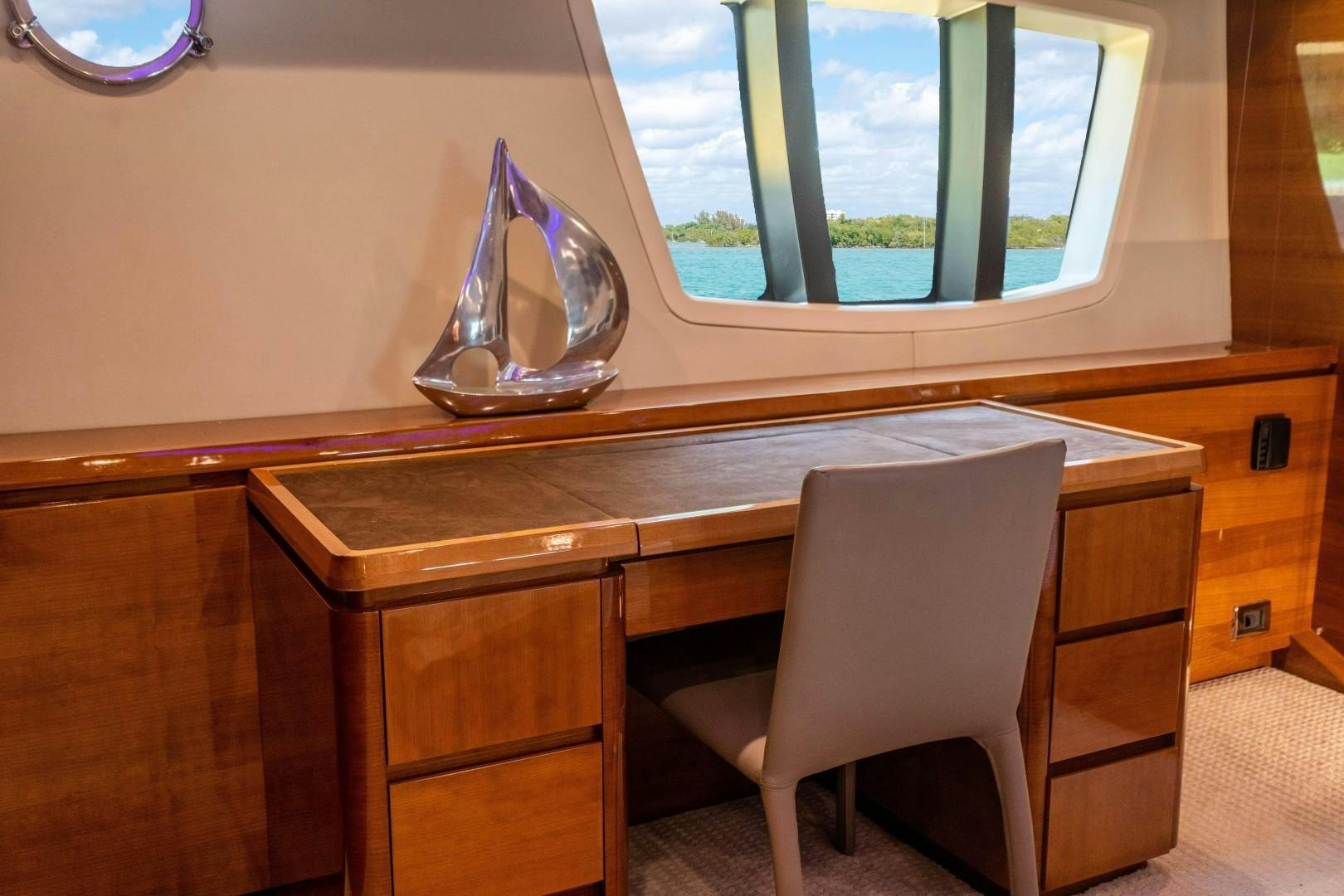 a desk with a chair aboard Blue Yacht for Sale