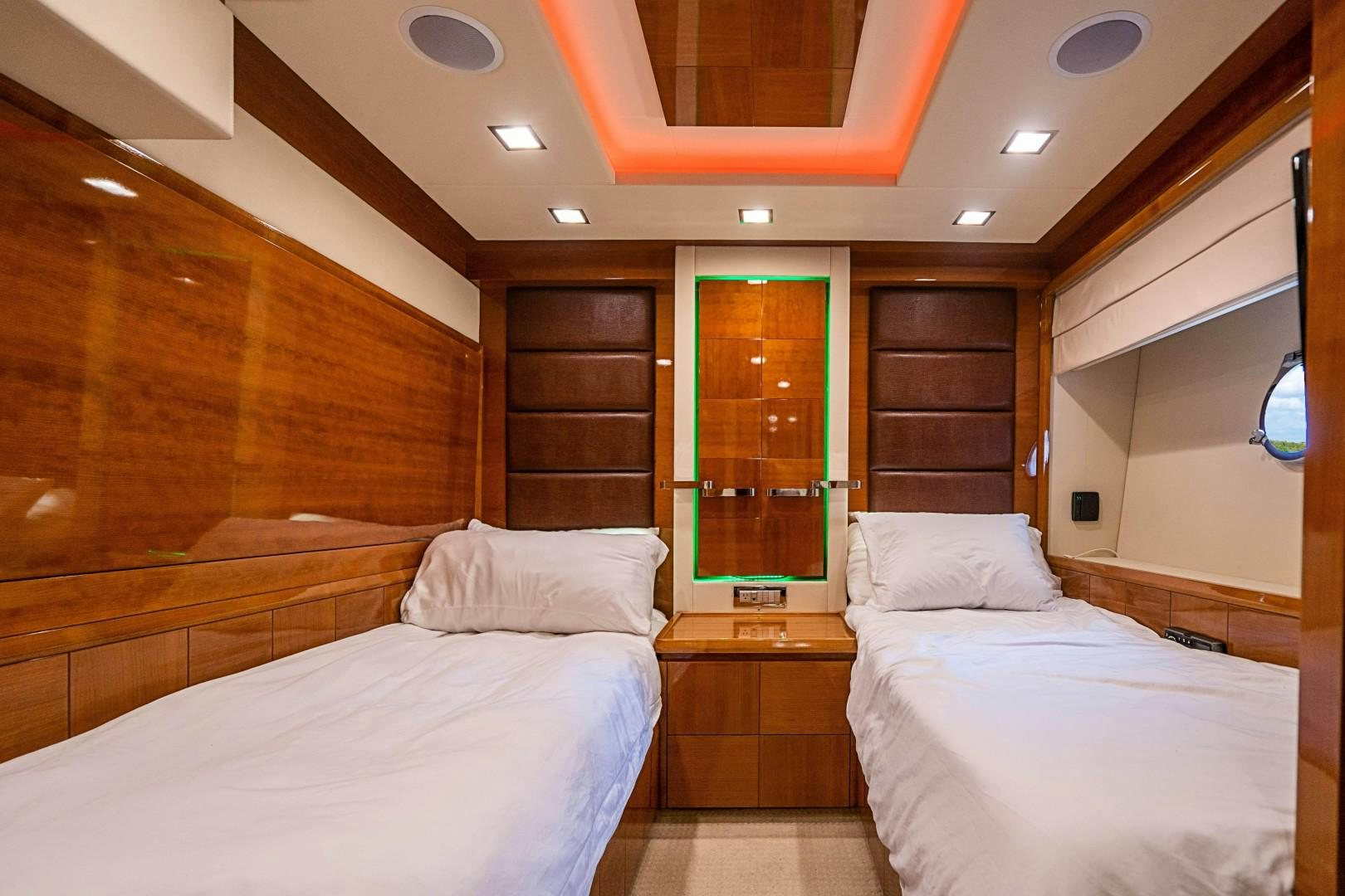 a room with two beds aboard Blue Yacht for Sale